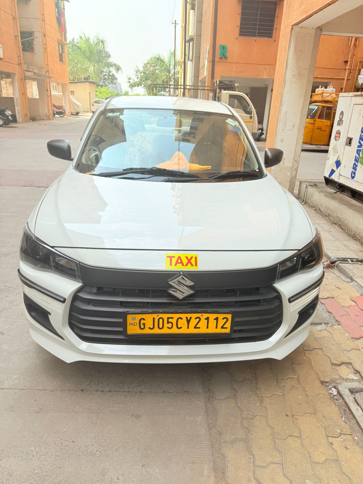 White sedan taxi